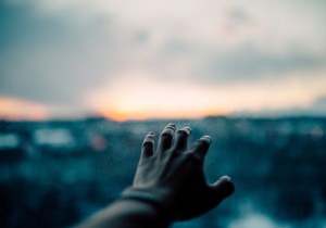 reaching hand in grief