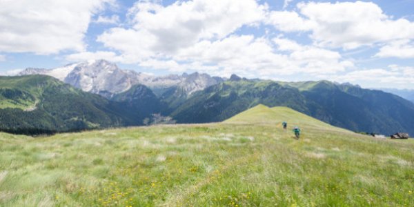 Man and woman mountain biking, Dolomites, Italy