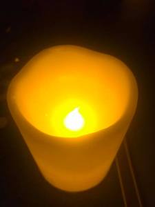 anchor retreat lit candle