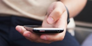 cell phone in hand huffpost